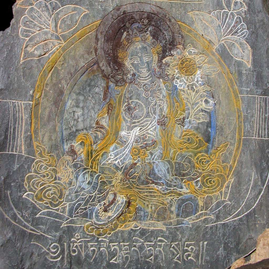 05-1 Green Tara Tara (Tib. Dolma) was born from the tear of Avalokiteshvara, the bodhisattva of compassion, and has the second most popular mantra in Tibet, Om Tare Tuttare Ture Svaha. She is called the Mother of all Buddhas and has 21 forms, with the two most popular being green and white. Green Tara is pictured as a green-skinned girl of 16 with a mischievous or playful nature. She has her right foot extended as if about to rise. Her left hand, in the gesture of granting refuge holds the stem of a blue utpala that waves over her left shoulder while her right hand also holding a flower, offers what we desire. Green Tara is identified with Bhrkuti, Songtsen Gampo�s Nepalese wife.